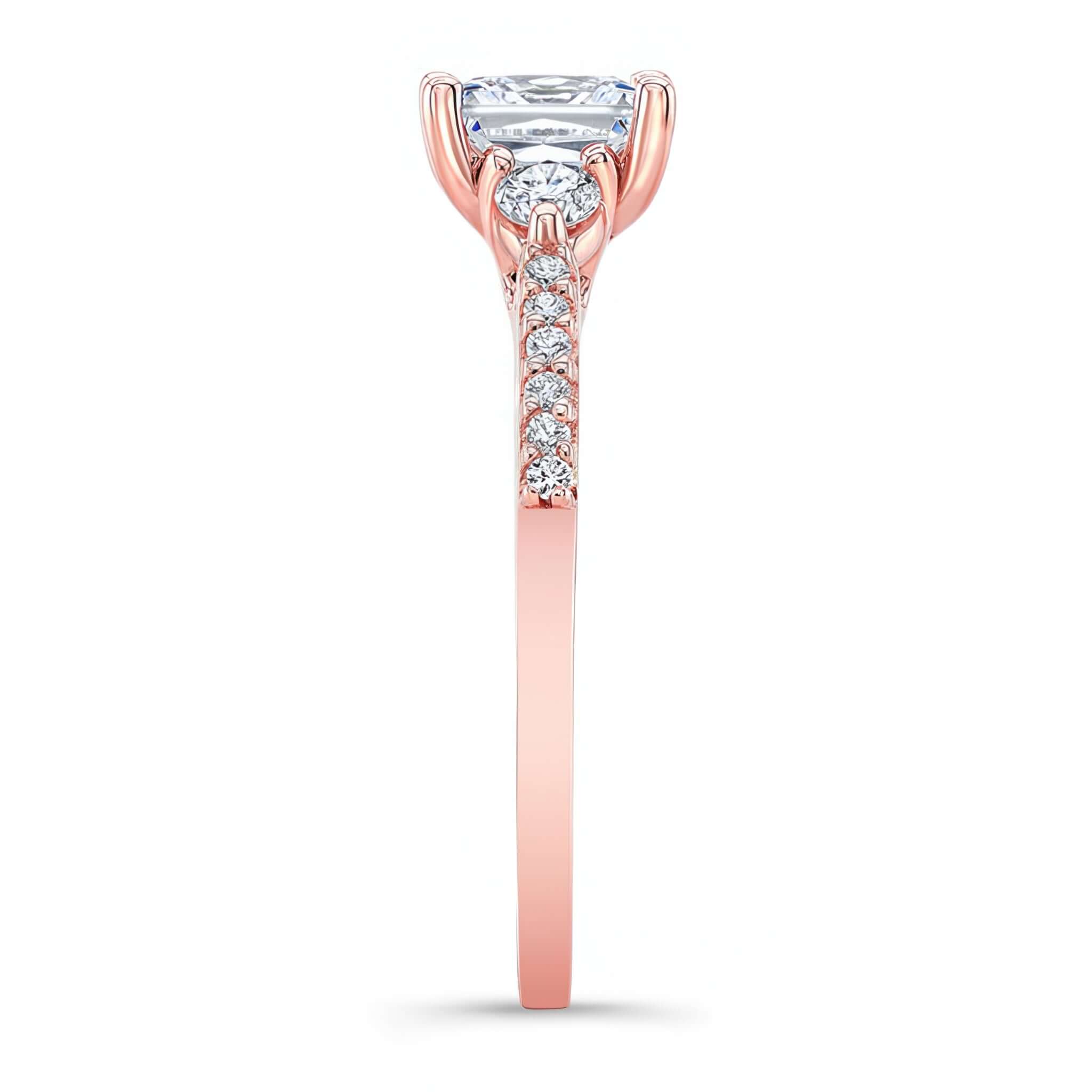 3 Stone Radiant Cut Engagement Ring featuring a prong-set diamond center and diamond accents on the band.