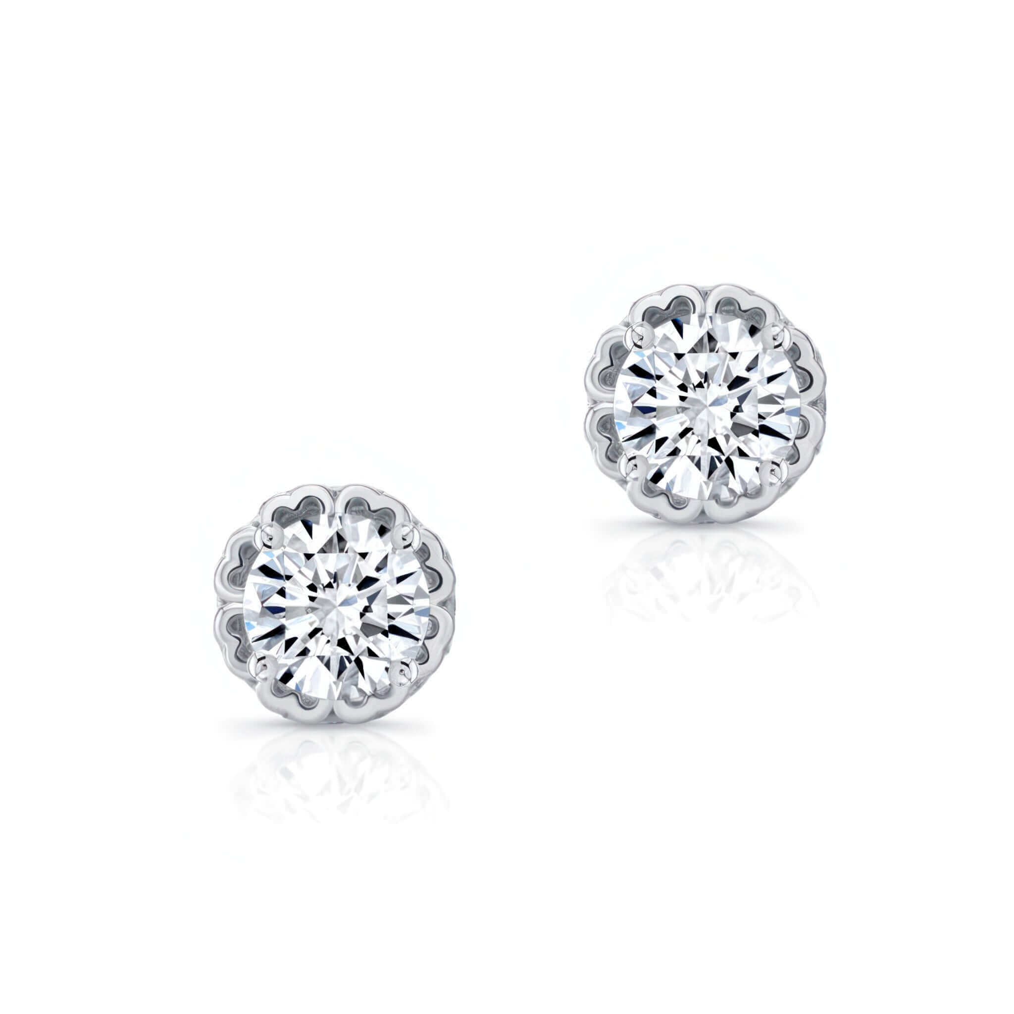 Pair of silver stud earrings with clear gemstones on a white background