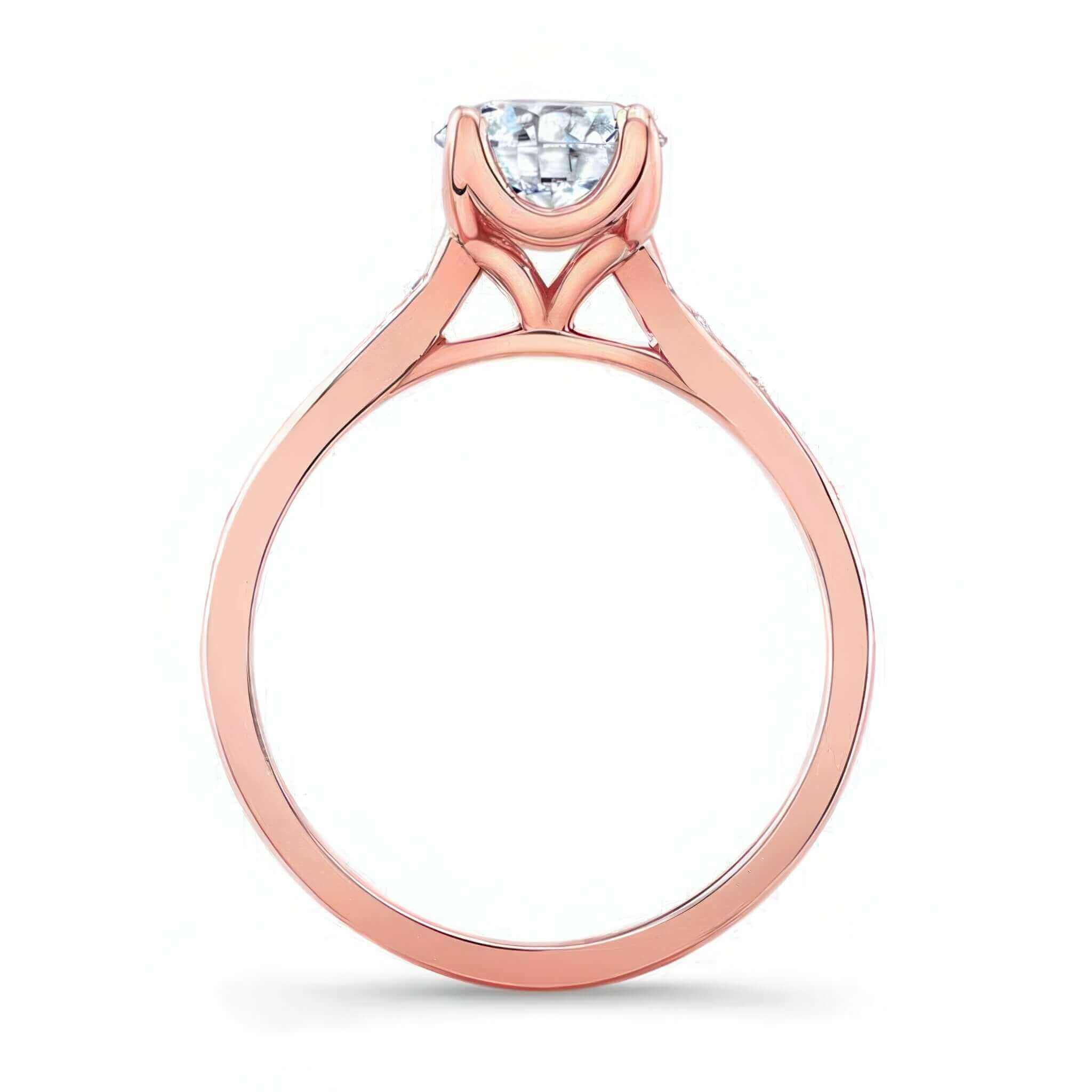 Classic Moissanite Engagement Ring with a delicate shank and prong set center diamond in rose gold.