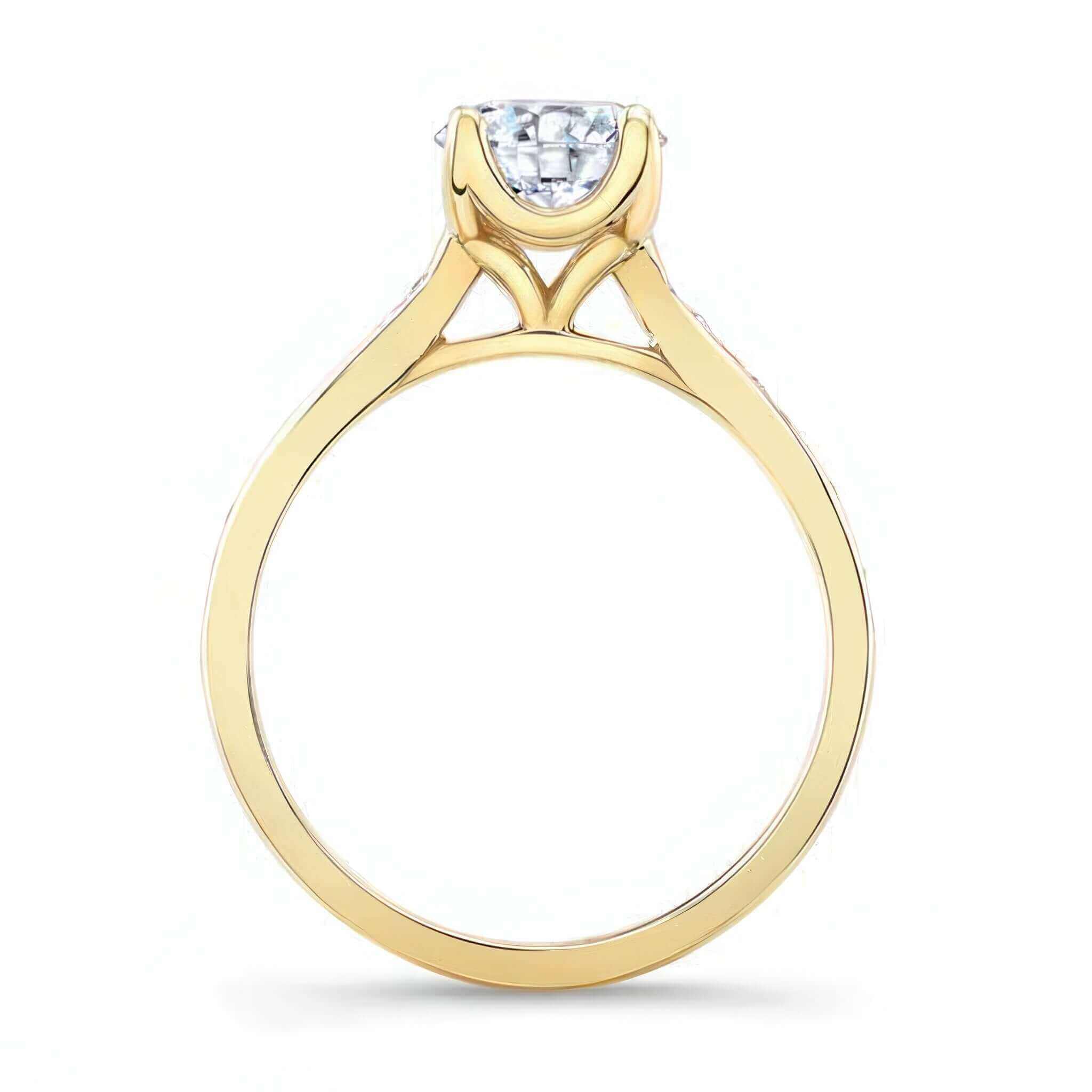 Classic Moissanite Engagement Ring with a delicate yellow gold shank and prong set round center.