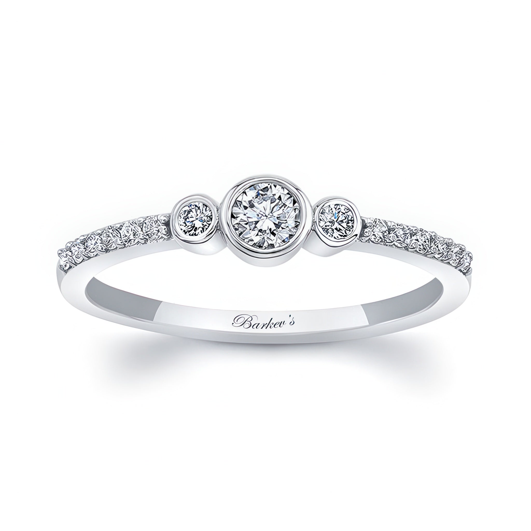 Mia three stone diamond promise ring with bezel set center and shared prong diamonds on a sleek white gold band.
