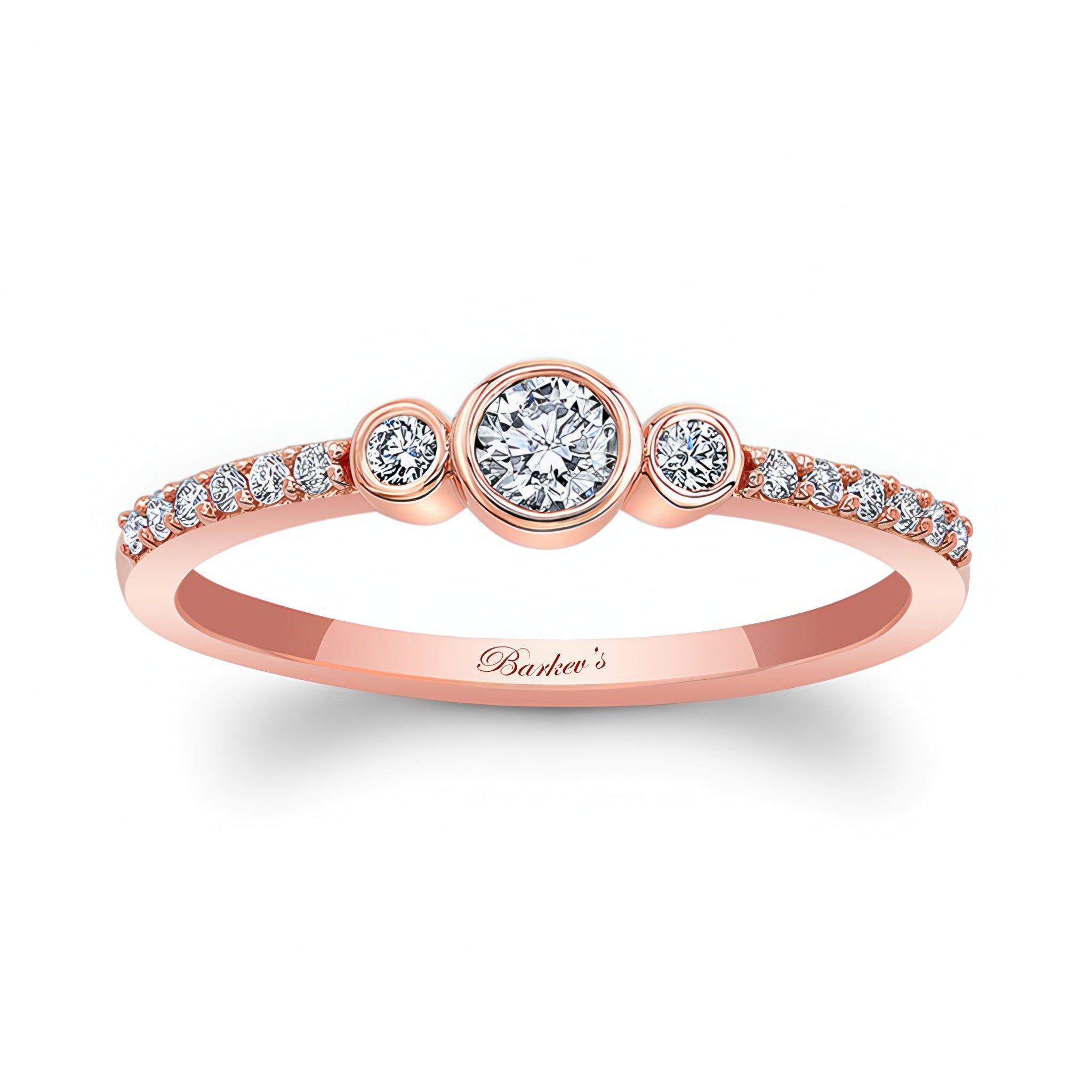 Mia Three Stone Diamond Promise Ring featuring a bezel set center diamond and shared prong set diamonds on a rose gold band.