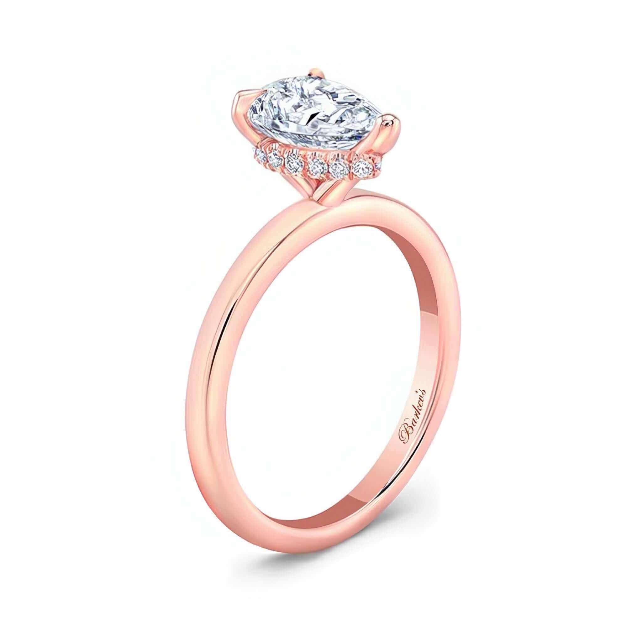 Hidden Halo Pear Engagement Ring featuring a pear shaped center and a micro pave halo for a stunning look.