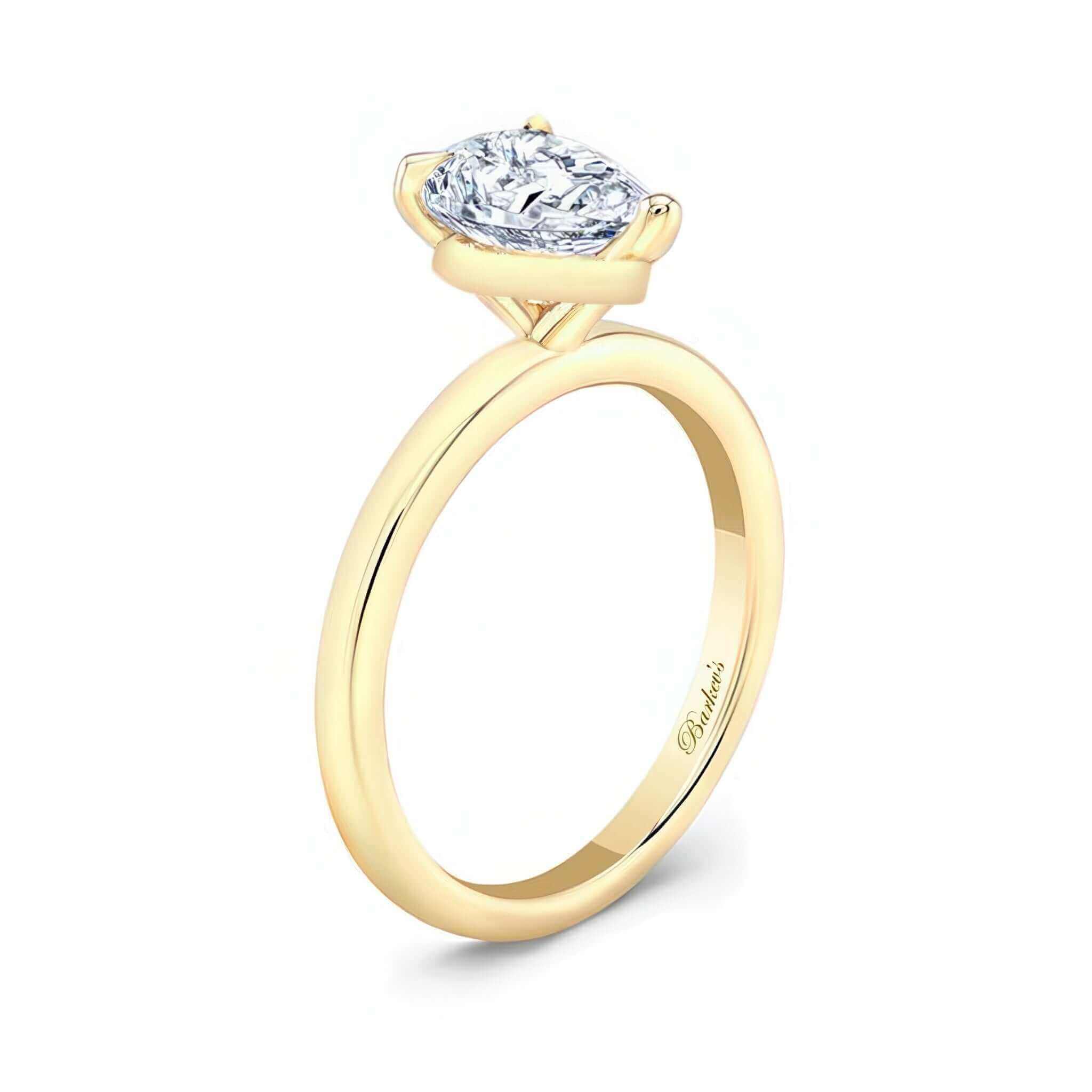 Pear Lab Grown Diamond Solitaire Ring with prong set pear shape diamond in a yellow gold band.