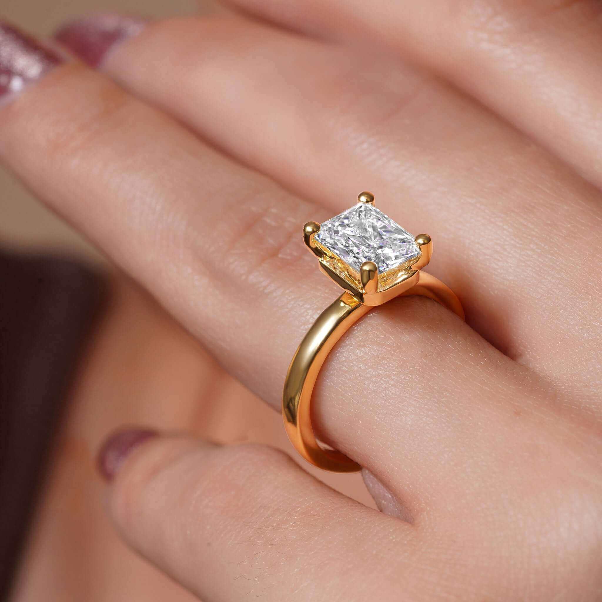 Radiant Cut Lab Diamond Solitaire Engagement Ring with a stunning 2.00ct center stone in a gold setting.