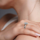Double Band 2 Carat Emerald Cut Diamond Solitaire Ring worn on hand, showcasing elegant design and brilliance.