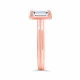 Double band 2 carat emerald cut diamond solitaire ring in rose gold, showcasing elegant design and exceptional brilliance.
