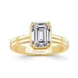 Double Band 2 Carat Emerald Cut Diamond Solitaire Ring in yellow gold showcasing elegance and brilliance.