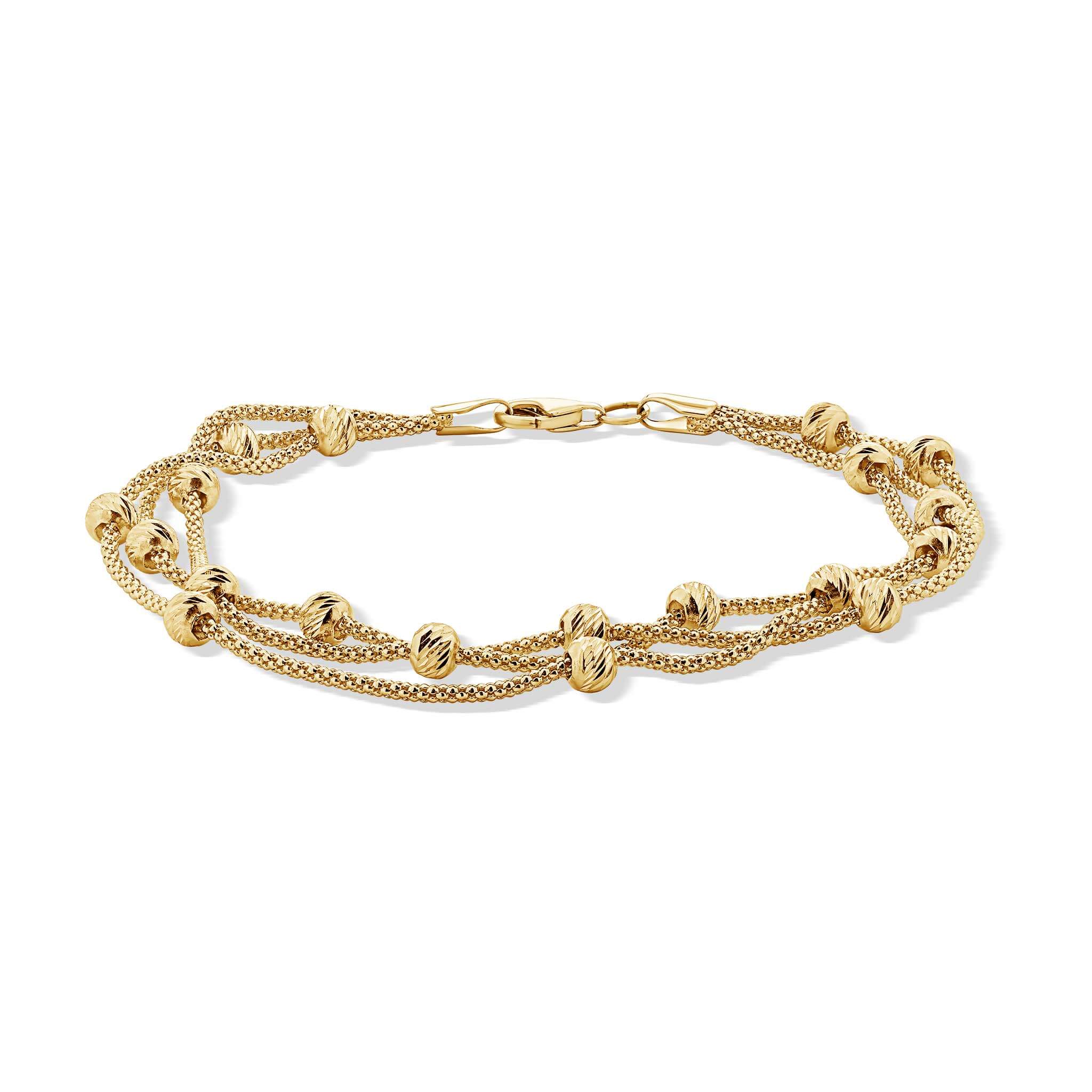 Gold bracelet with multiple chains and beads on a white background