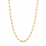 Gold necklace with star-shaped links on a white background