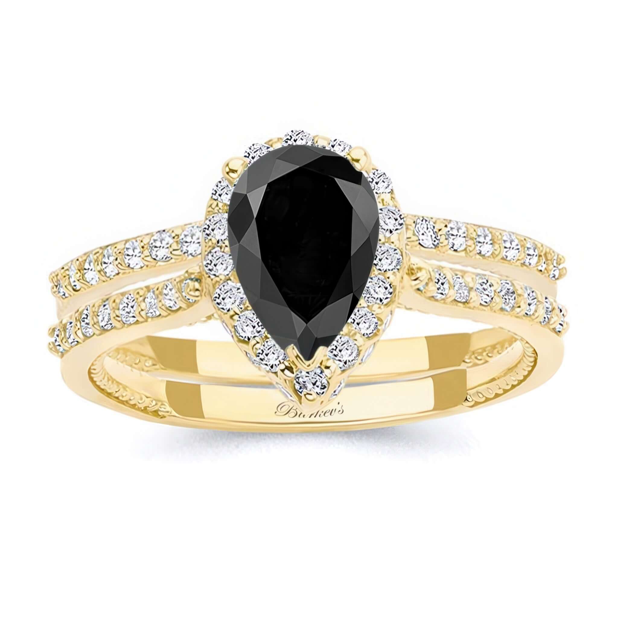 Pear Shaped Black And White Diamond Halo Ring Set showcasing a black pear diamond center and shimmering diamond accents.