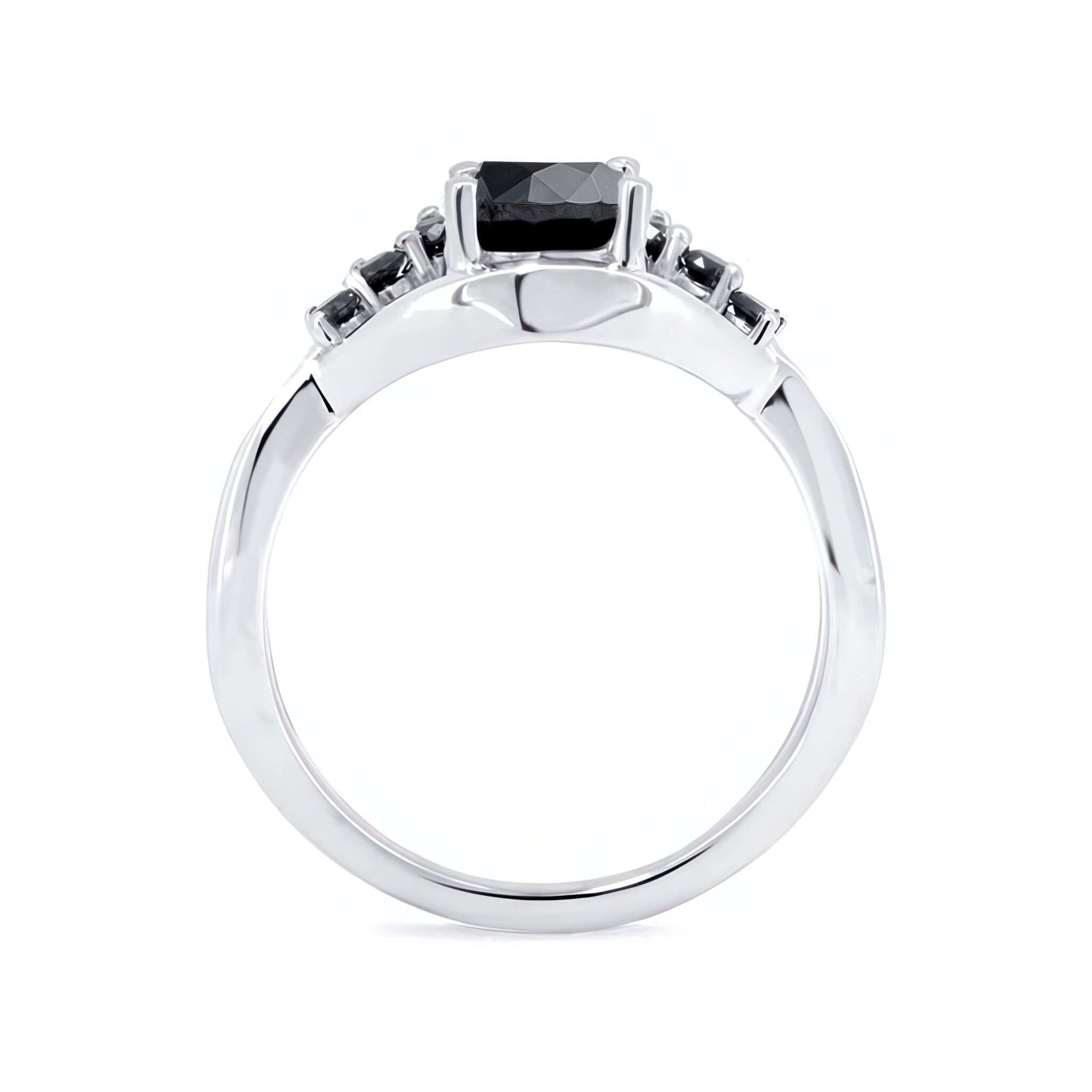 Black Diamond Unique Engagement Ring featuring a central black diamond and shared prong set accent stones.