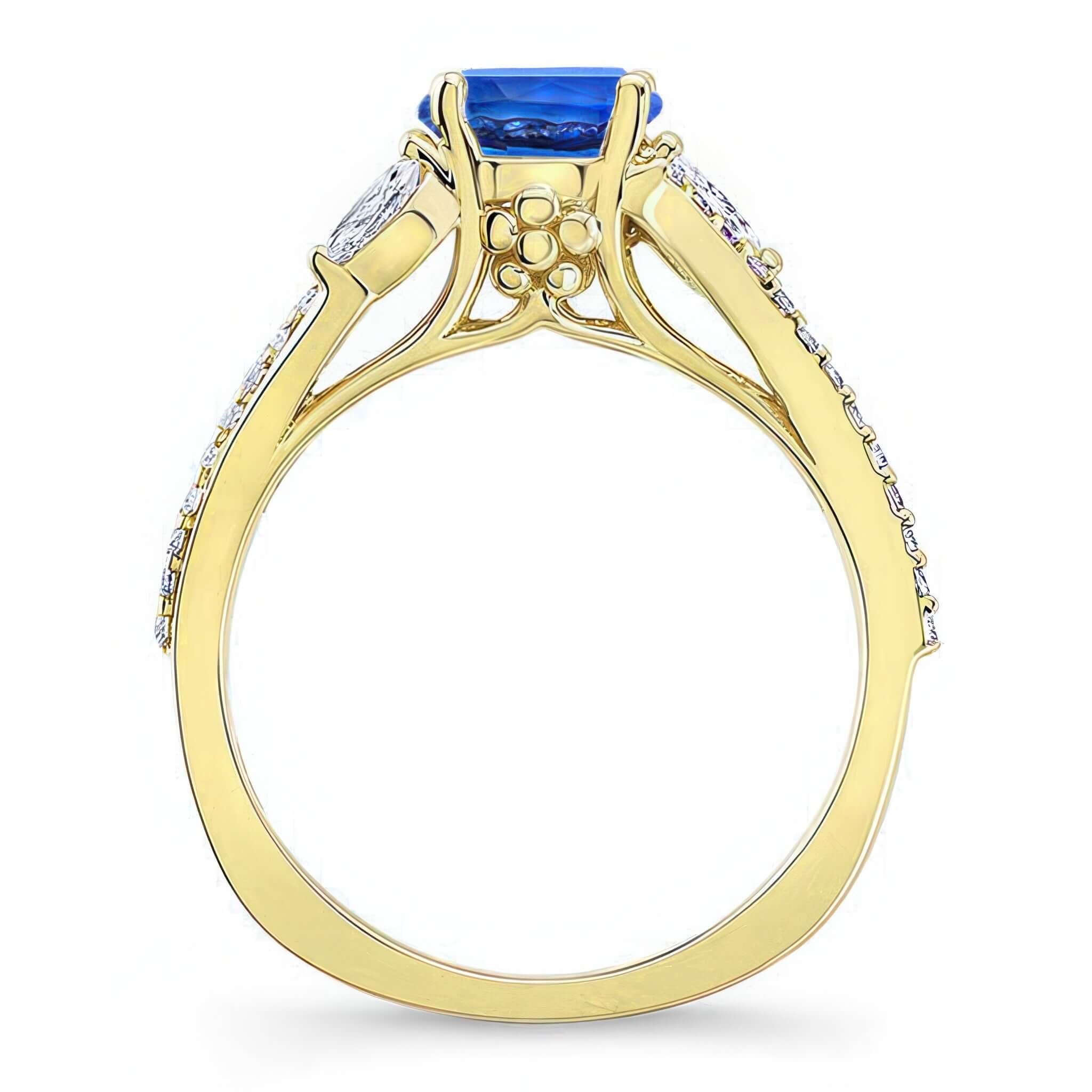 Curved Split Shank Blue Sapphire And Diamond Ring showcasing a striking blue sapphire and diamond accents.