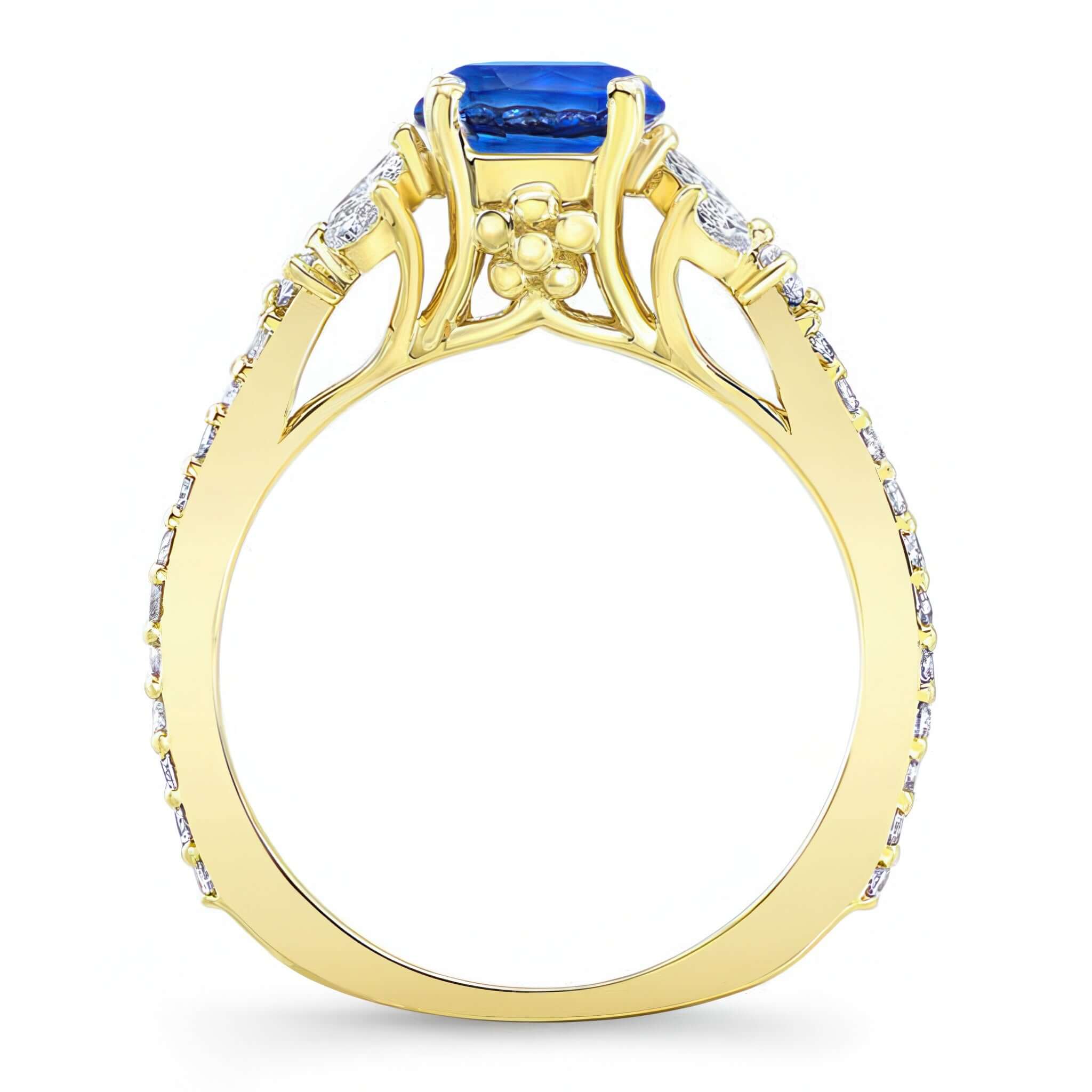 Blue Sapphire And Diamond Leaf Engagement Ring featuring a prong set blue sapphire and elegant leaf design.
