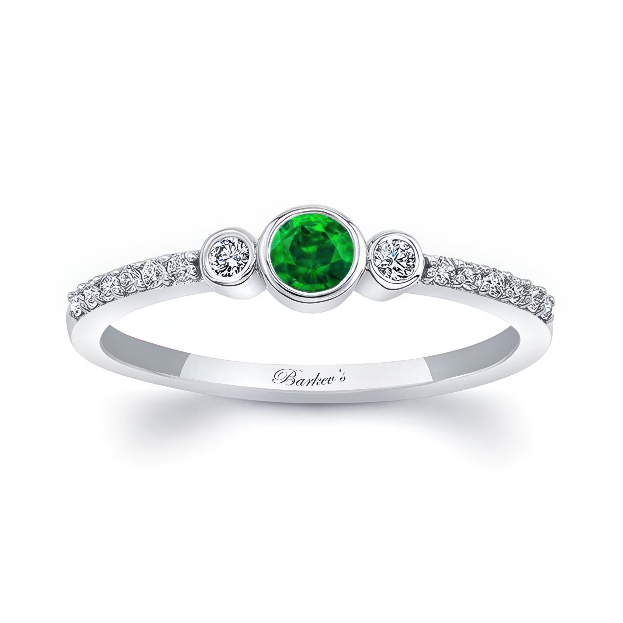 Mia Emerald three stone diamond promise ring featuring a vibrant emerald center and sparkling diamond accents.