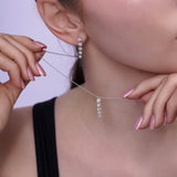 Model showcasing Floating Five-Stone Lab Diamond Pendant Necklace with elegant jewelry details.