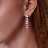 9 Carat Floating Lab Diamond Earrings showcasing graduated lab-grown diamonds in a modern drop design.