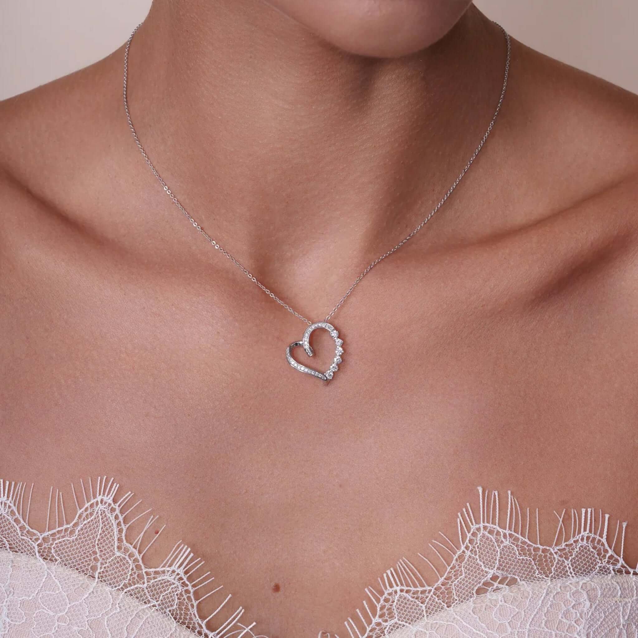 Lab Diamond Graduated Heart Necklace featuring round lab-grown diamonds in a delicate open heart design.