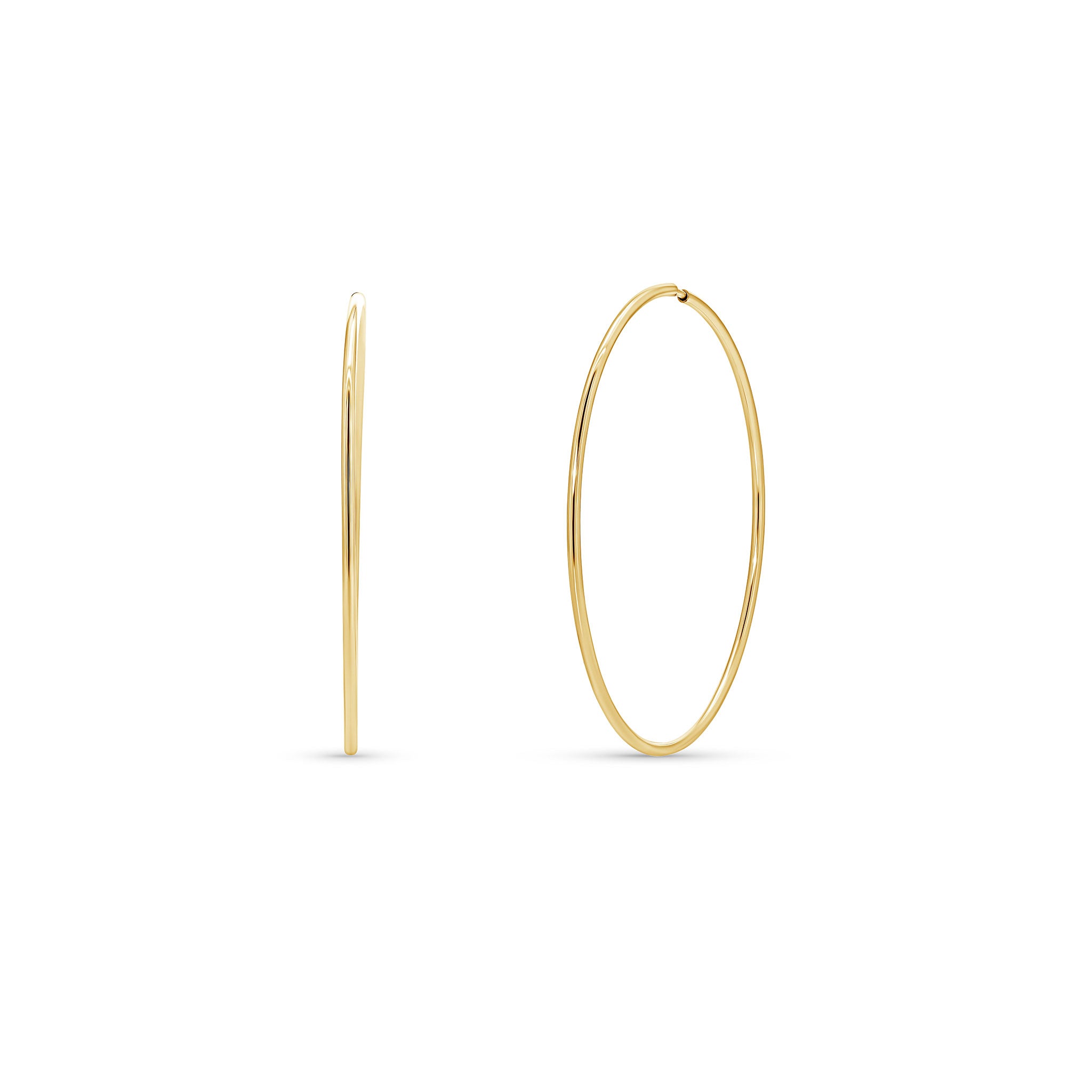 Gold Endless Hoop Earrings showcasing a sleek, timeless design, perfect for casual and formal occasions.