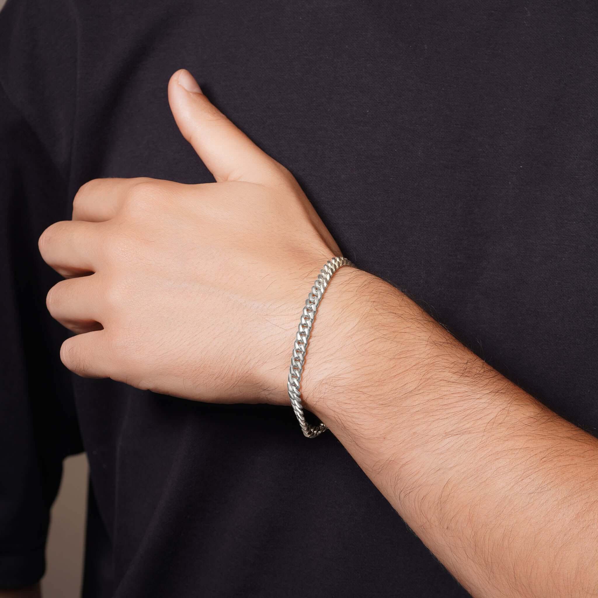Men's Silver Miami Cuban Bracelet worn on wrist, showcasing its polished silver finish and classic Cuban-link design.