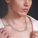 Men wearing a stunning solid gold curb chain necklace, showcasing its elegance and shine against bare skin.