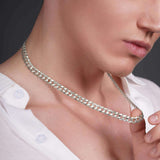 Men wearing a silver solid gold curb chain, showcasing its polished links and stylish design.