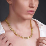 Men's solid gold curb chain necklace displayed on a model, showcasing its sleek design and craftsmanship.