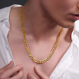 Men's solid gold curb chain worn around the neck, showcasing its elegant shine and classic design.