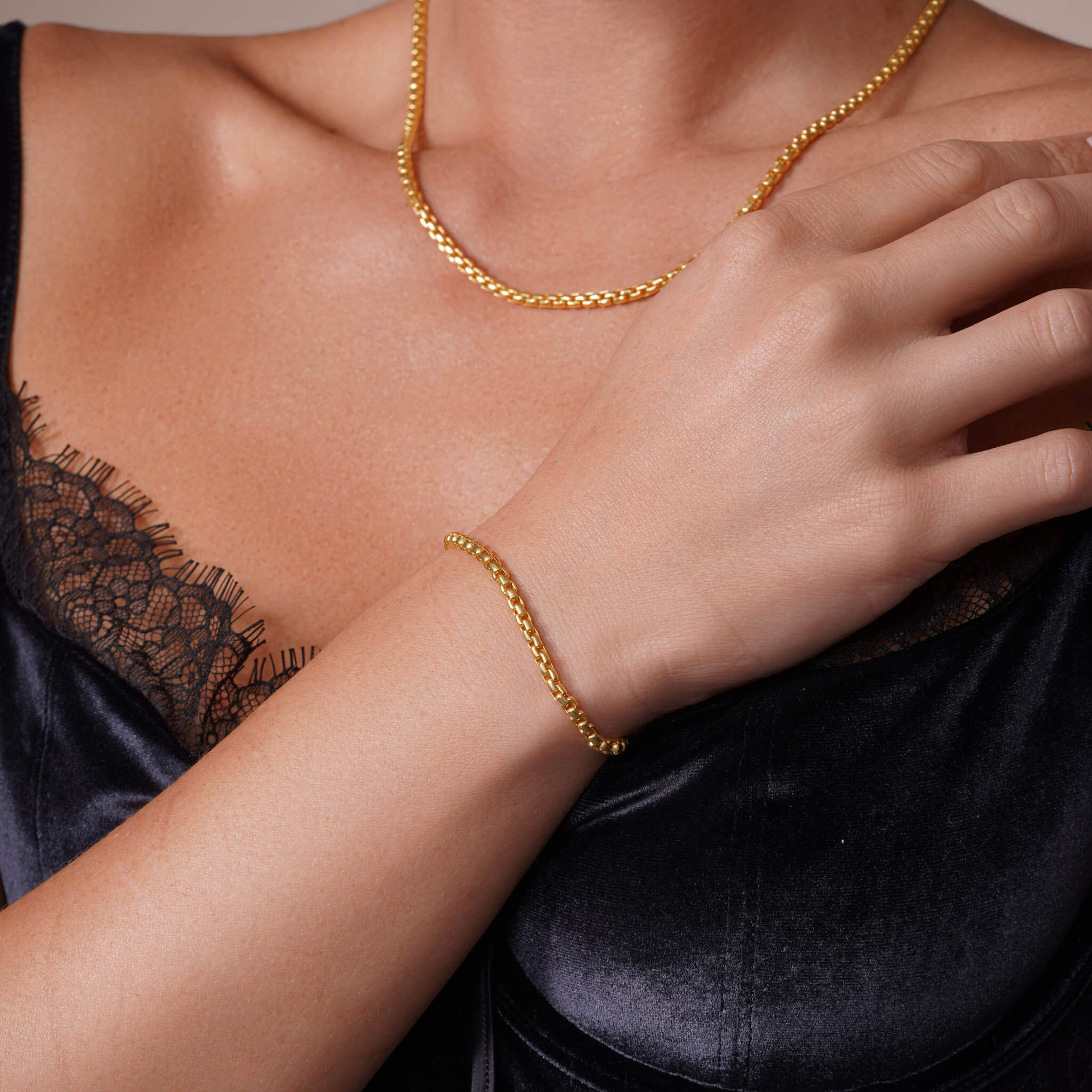 Elegant Round Box Chain Bracelet worn with a matching necklace, showcasing a sleek gold design ideal for any occasion.
