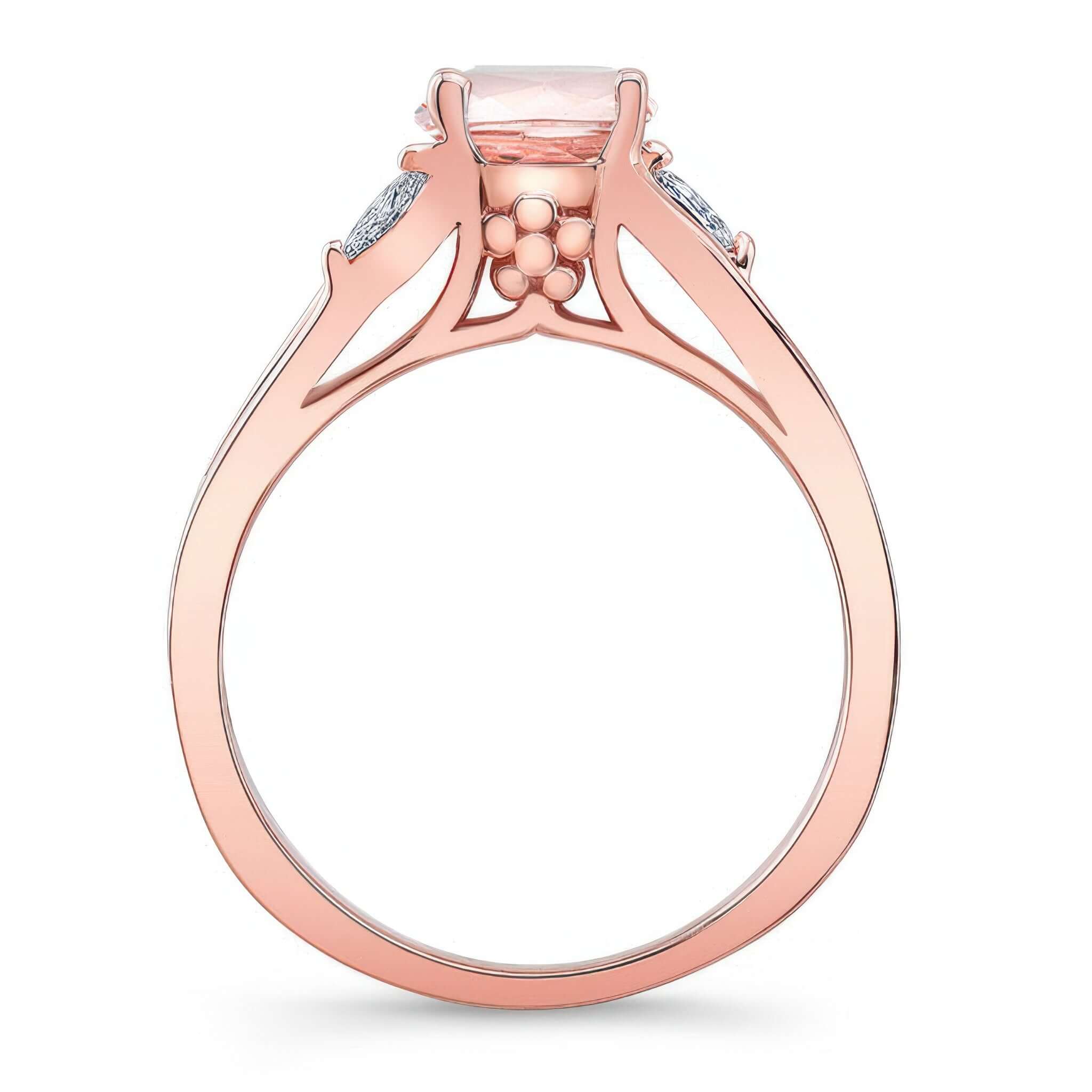 V Shaped Morganite And Diamond Ring showcasing a prong set round center and marquise cut diamonds on the shoulders.