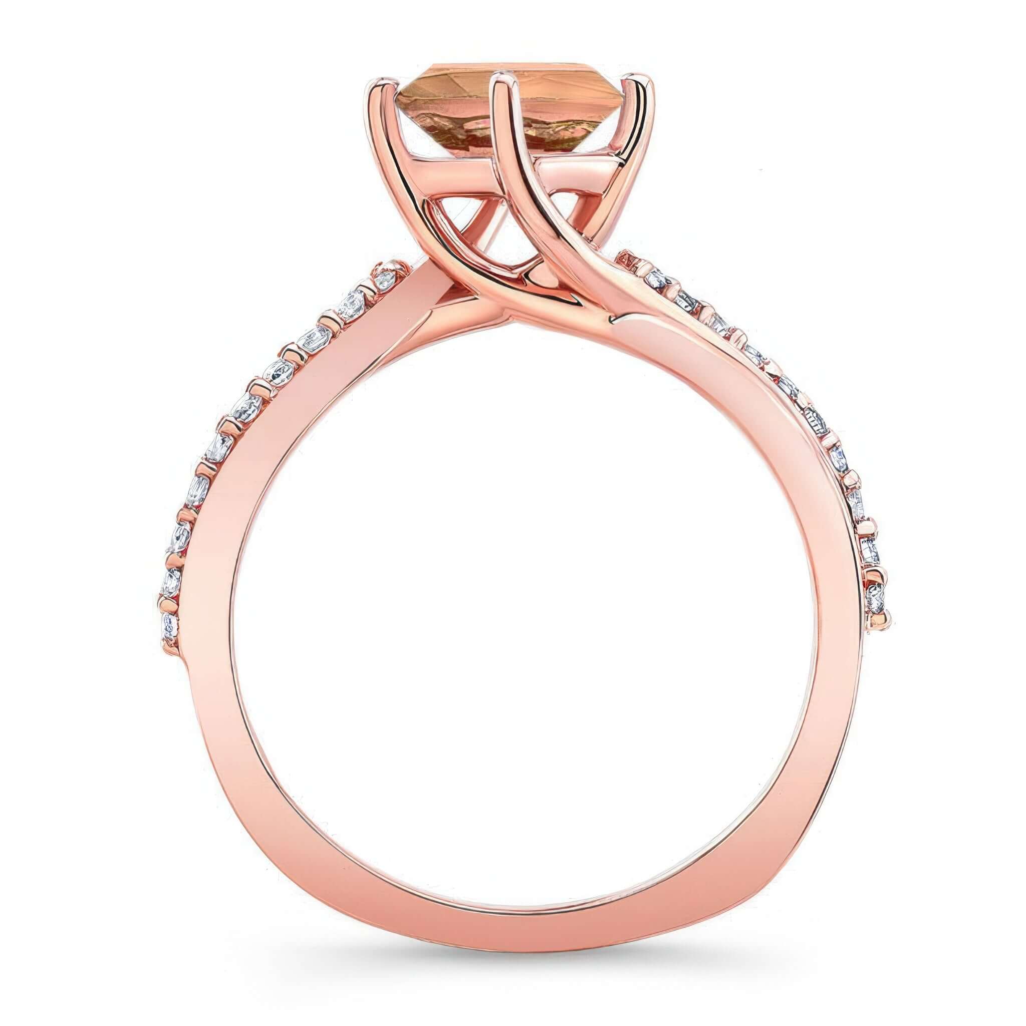 Twisted Morganite And Diamond Engagement Ring with a round-cut morganite and modern twisting band design.