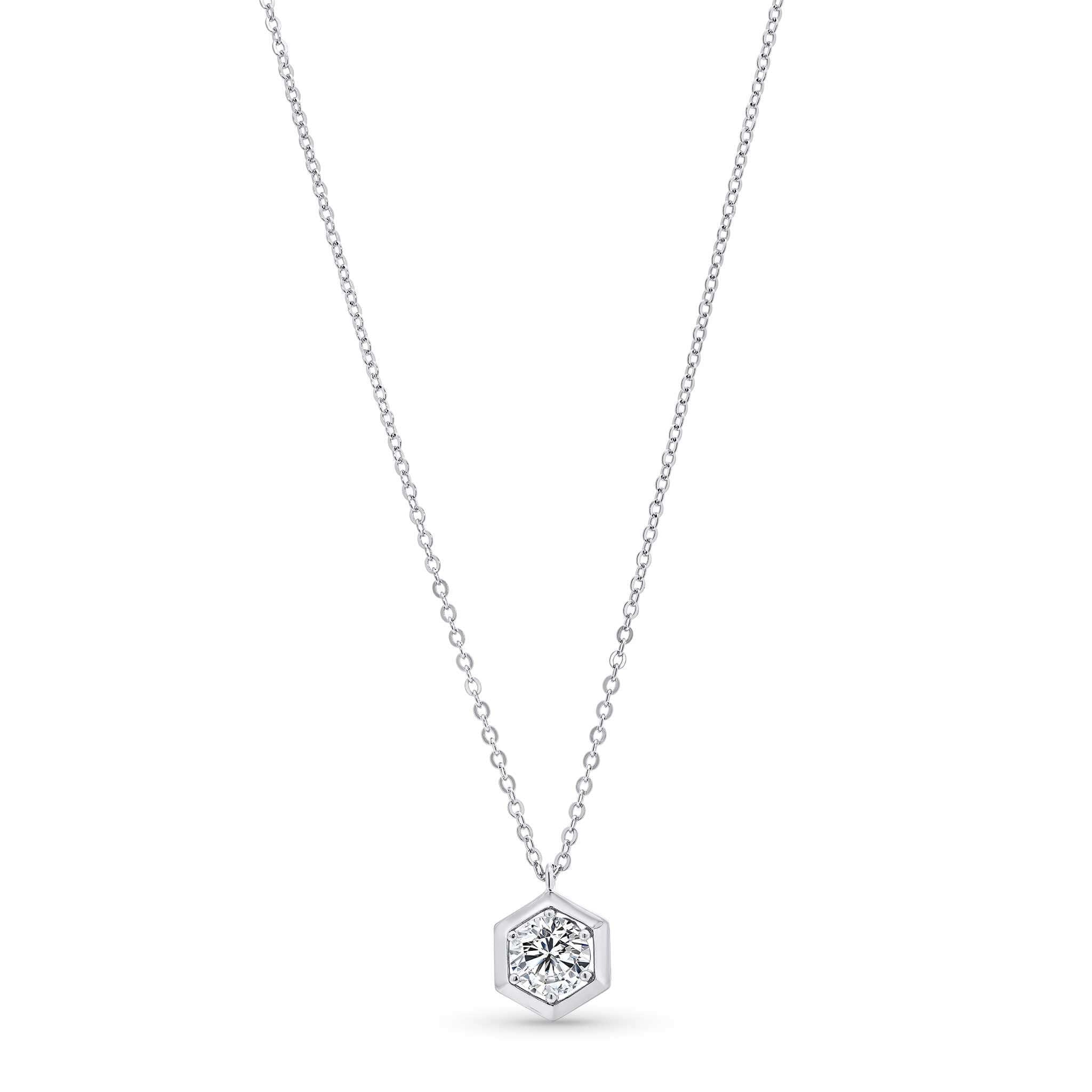 Silver hexagonal pendant necklace on a white background