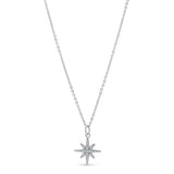 Star-shaped moissanite pendant on a chain against a white background
