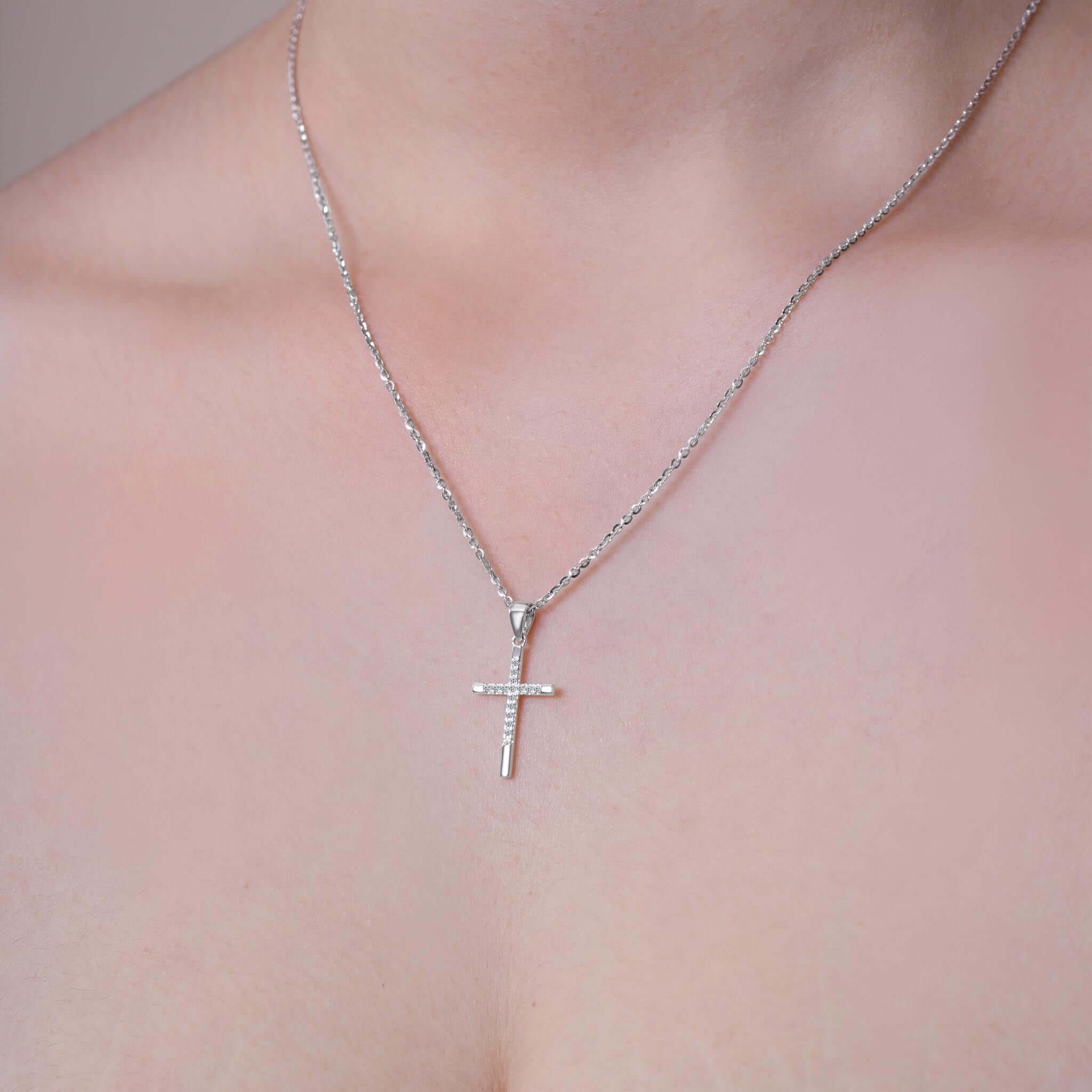 Elegant Cross Moissanite Silver Pendant Necklace worn elegantly, showcasing its radiant design and polished silver finish.