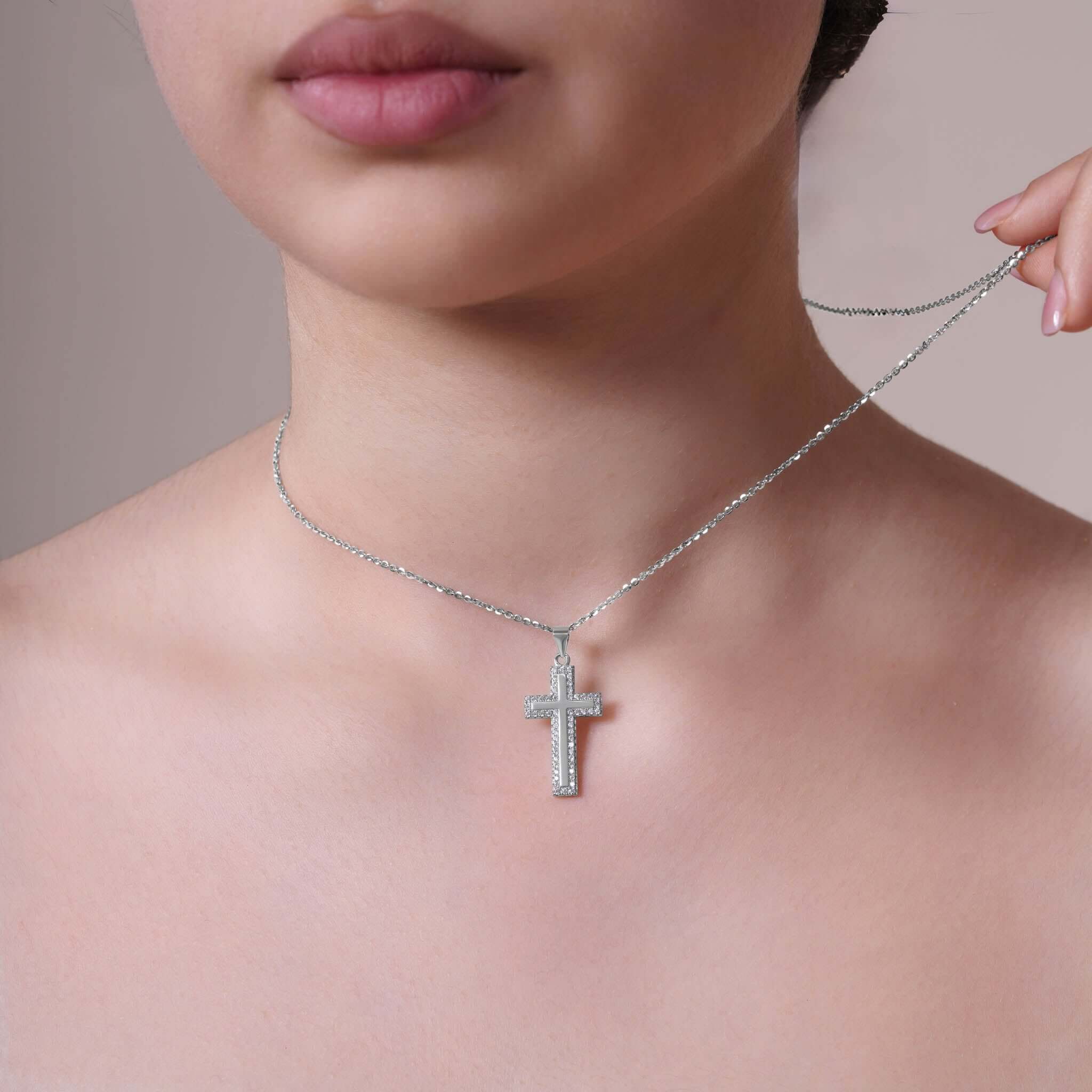 Framed Moissanite Cross Silver Pendant Necklace worn by model, showcasing its brilliance and elegant design.