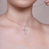 Framed Moissanite Cross Silver Pendant Necklace worn elegantly on a model's neck, showcasing its brilliant sparkle.