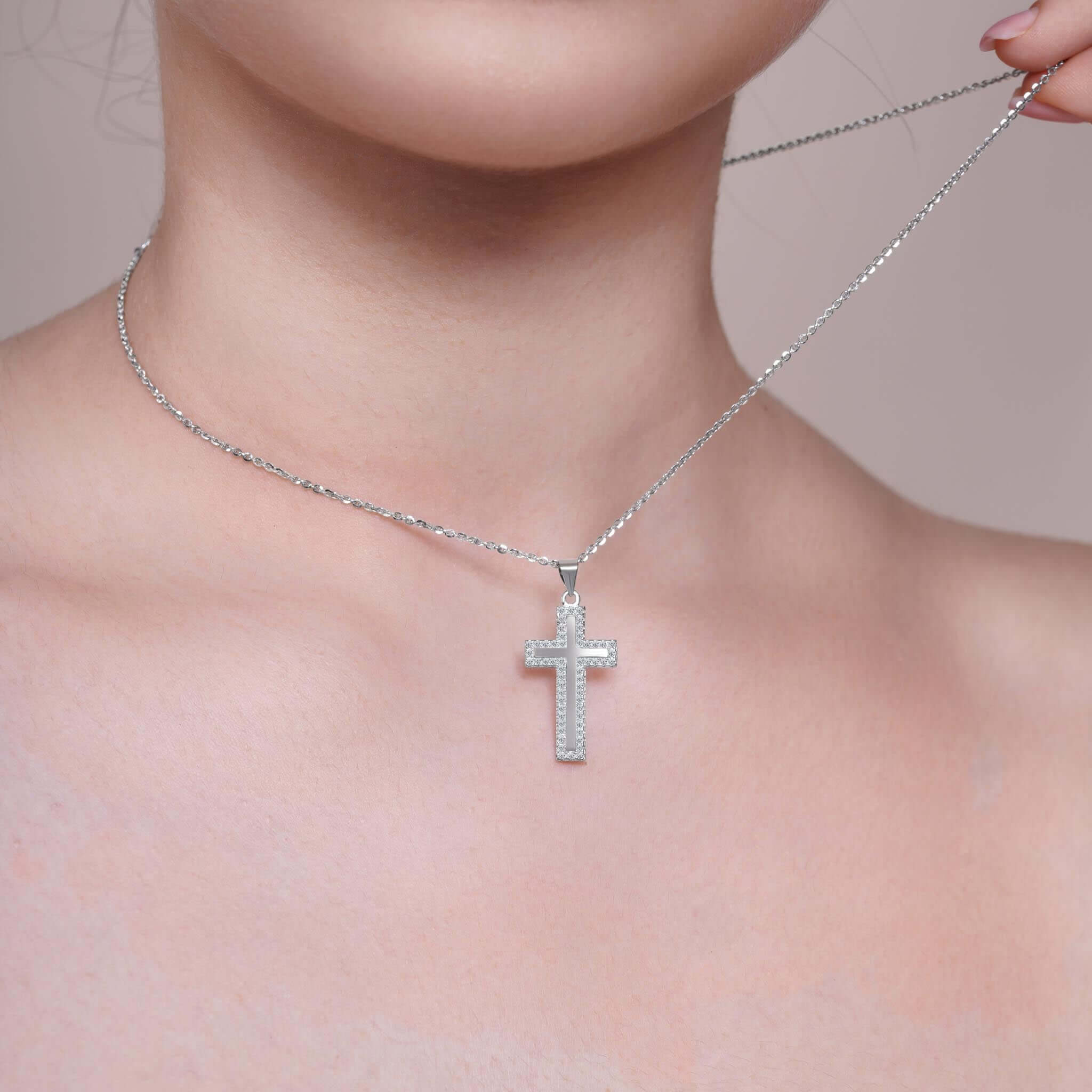 Framed Moissanite Cross Silver Pendant Necklace worn elegantly on a model's neck, showcasing its brilliant sparkle.
