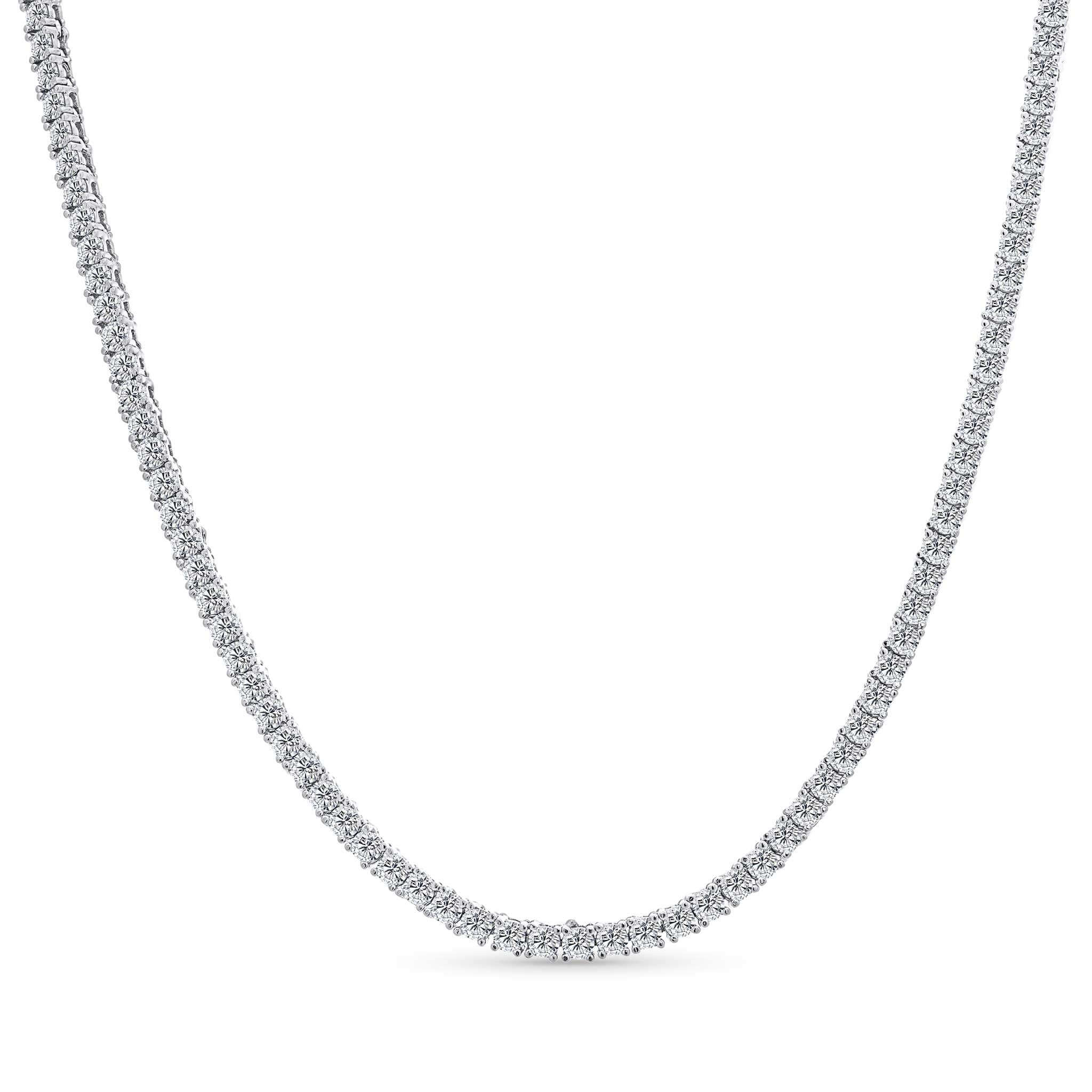 Silver necklace with small round moissanite diamonds on a white background