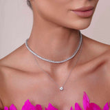Model showcasing a Round Moissanite Silver Necklace with two layered designs featuring brilliant stones.
