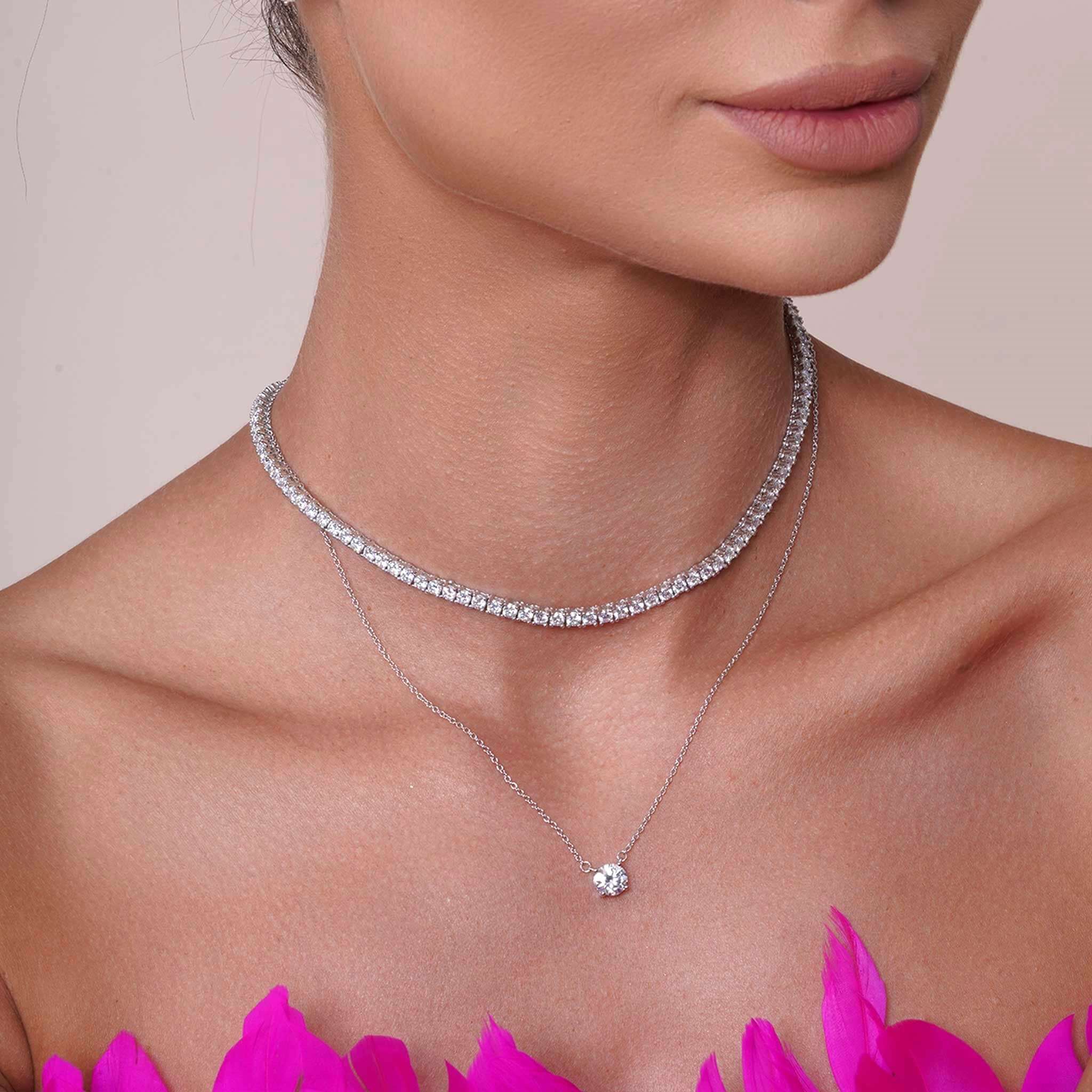 Model showcasing a Round Moissanite Silver Necklace with two layered designs featuring brilliant stones.