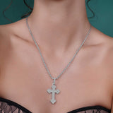 Silver Moissanite Budded Pavé Cross Pendant Necklace worn on model, showcasing its sparkling design and sterling silver chain.