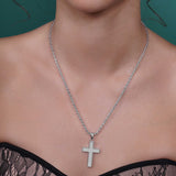 Silver Moissanite Pavé Milgrain Cross Pendant Necklace worn on a model, highlighting its elegant design and sparkle.