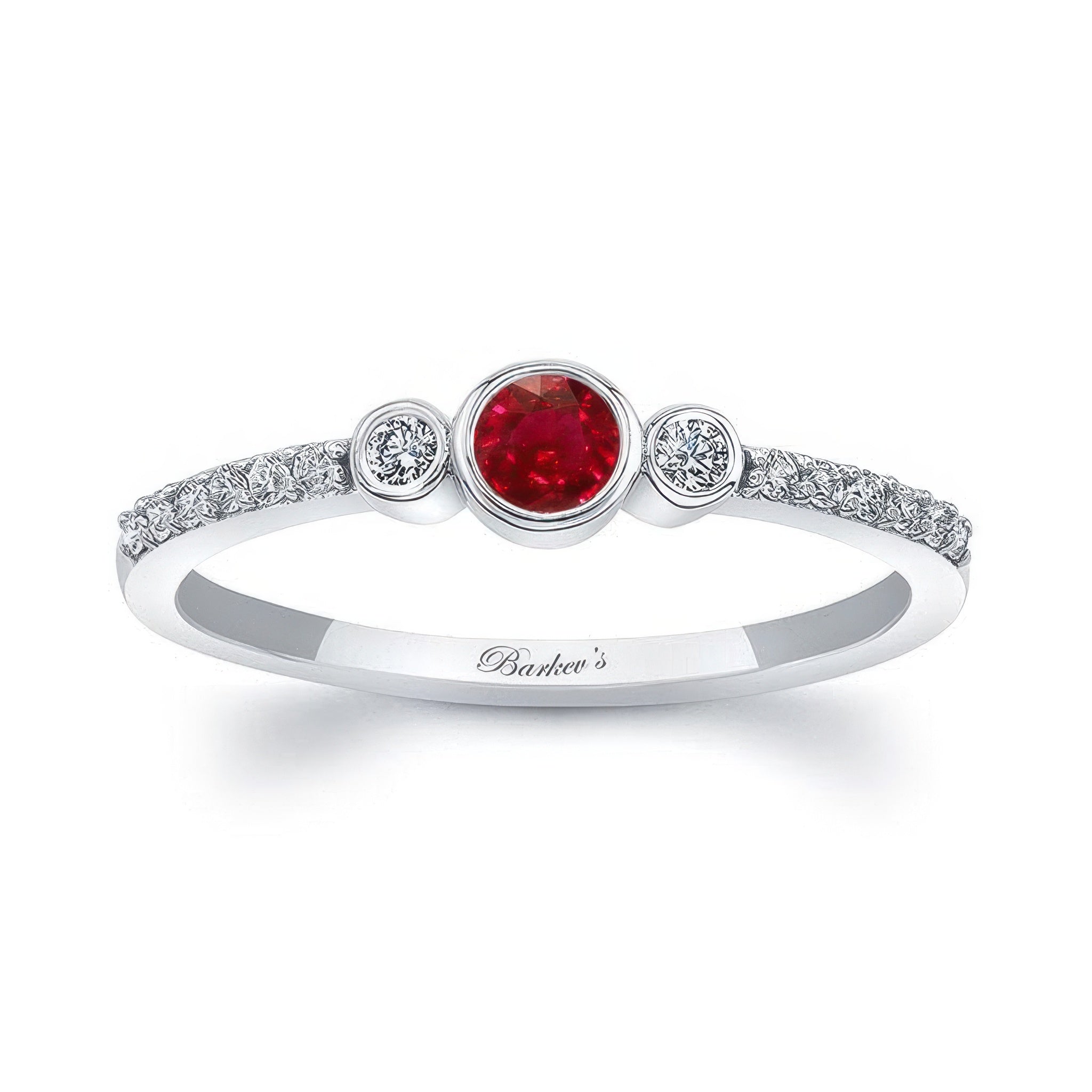 Mia Ruby Three Stone Diamond Promise Ring featuring a central ruby and sparkling diamonds on both sides.