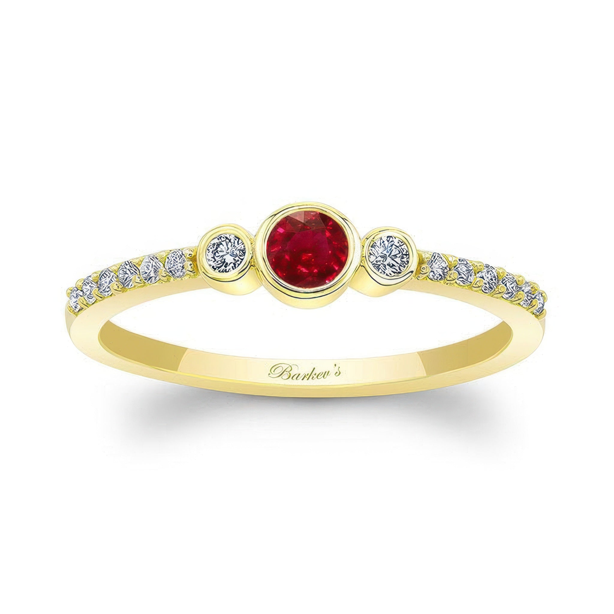 Mia Ruby three stone diamond promise ring featuring a central ruby and bezel-set diamonds in a yellow gold band.