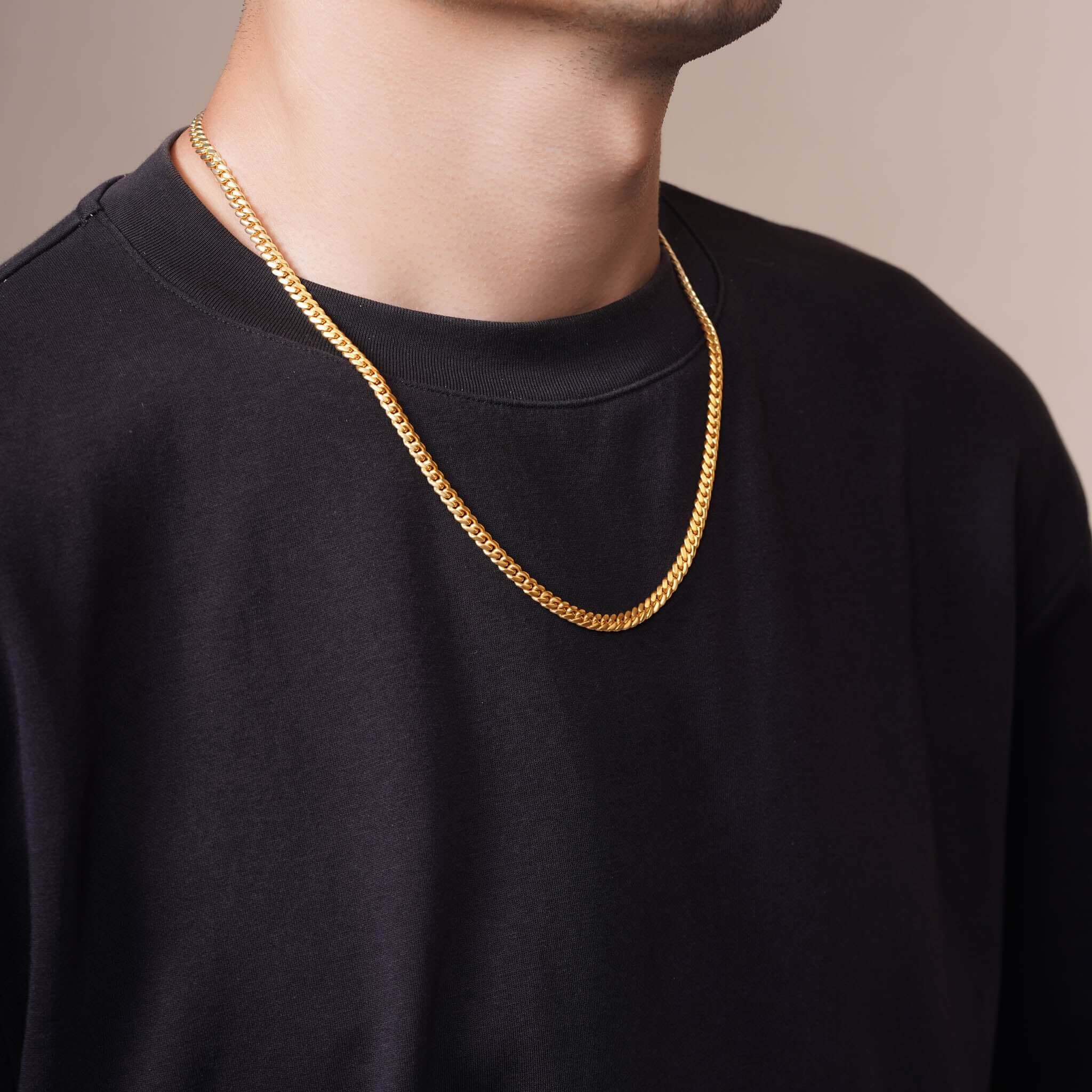 Men's Vermeil Miami Cuban Chain worn by a model, showcasing its elegant design and luxurious 18k gold vermeil.