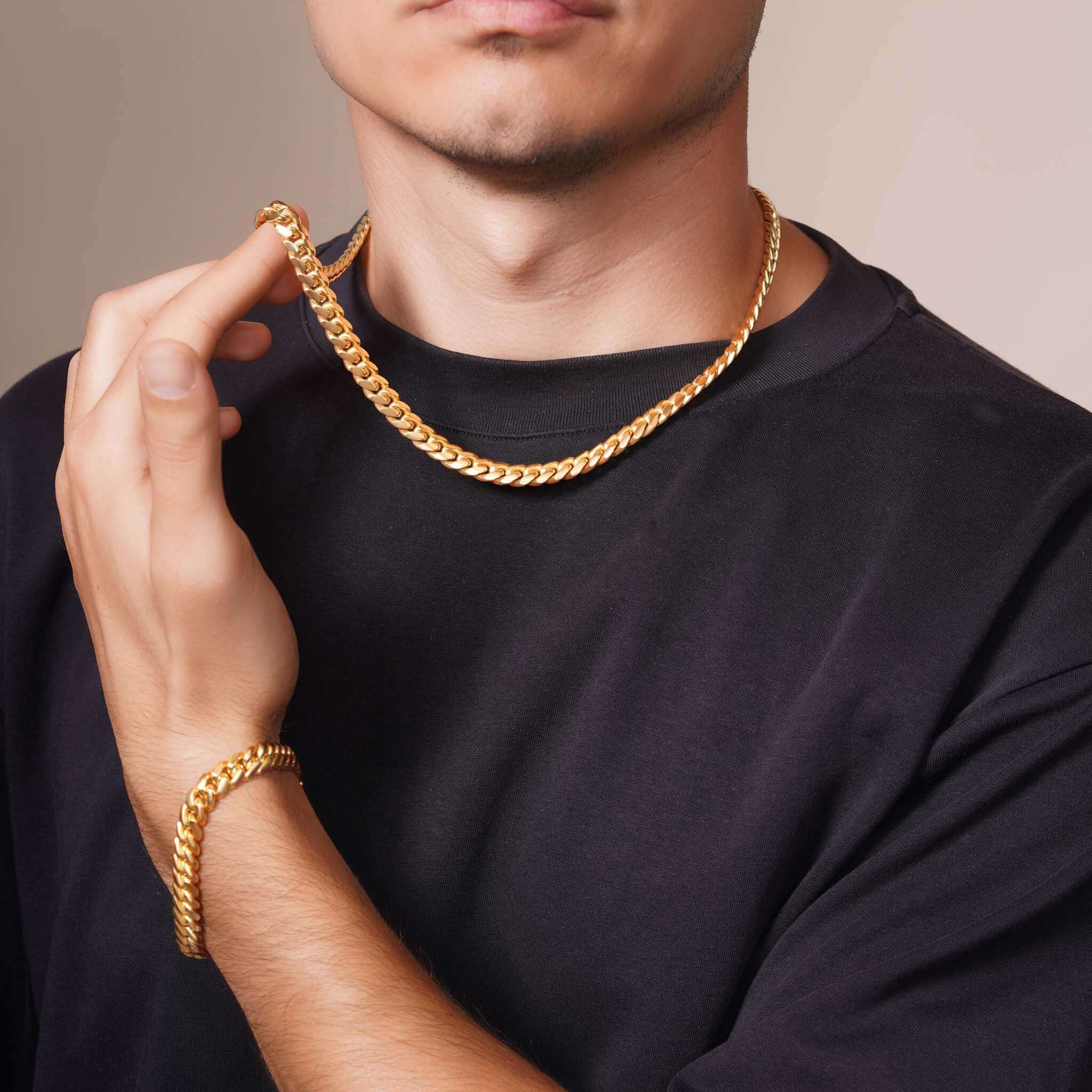 Men's Vermeil Miami Cuban Chain worn by a man, showcasing its gold vermeil shine and classic design.