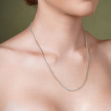 Franco Silver Chain displayed elegantly on a model's neck, showcasing its smooth polished finish and distinctive design.