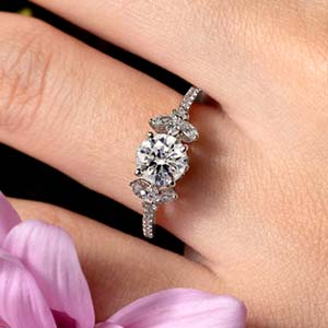 Hand showing a nature-inspired engagement ring